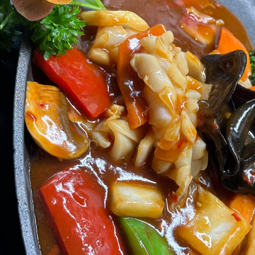 Calamars aux légumes sur plaque chauffante